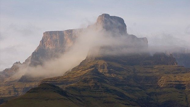 Flat-topped mountain of the Drakensberg veiled in cloud